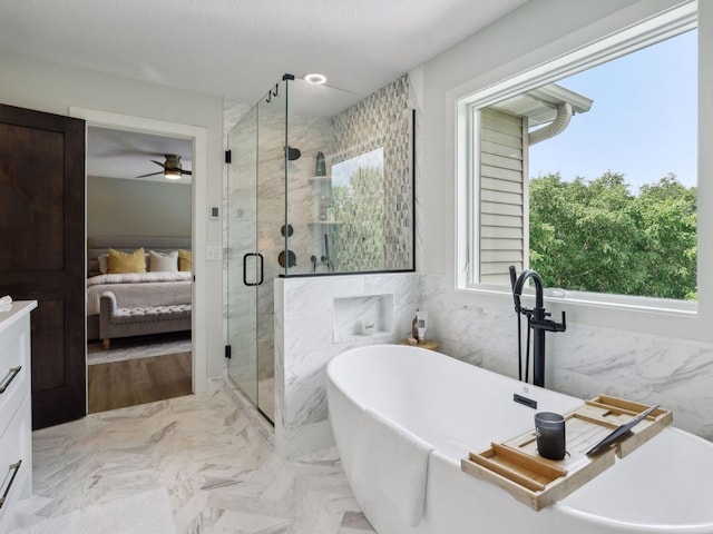 bathroom featuring a soaking tub, ceiling fan, a shower stall, tile walls, and connected bathroom