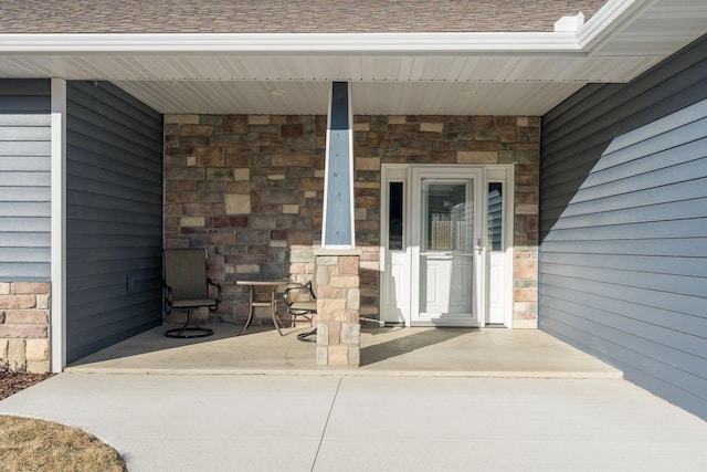 property entrance featuring a patio area