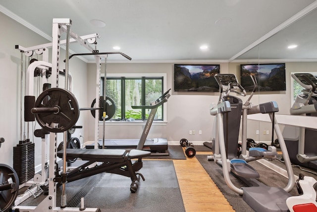 workout room with crown molding and wood-type flooring