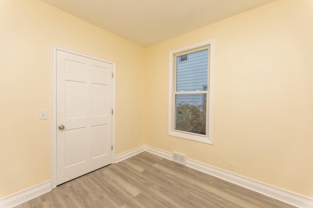 empty room with light wood-type flooring