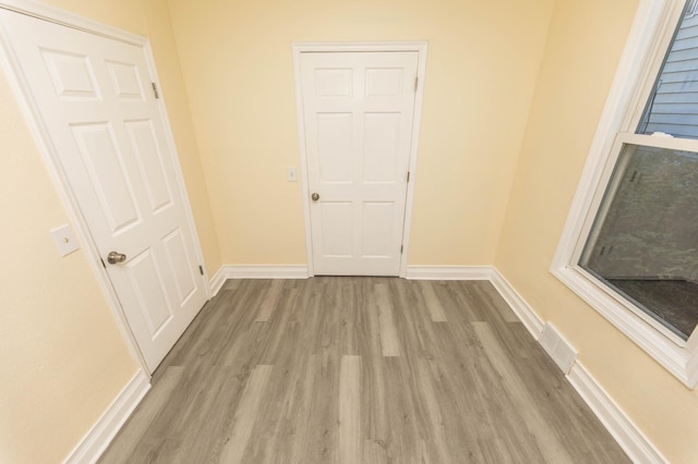 empty room with light wood-type flooring