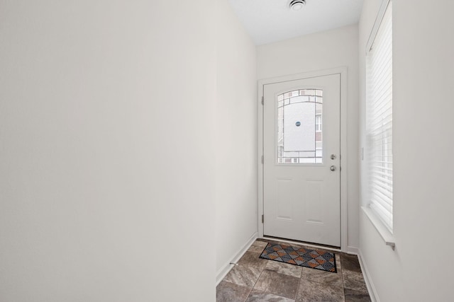 doorway with baseboards