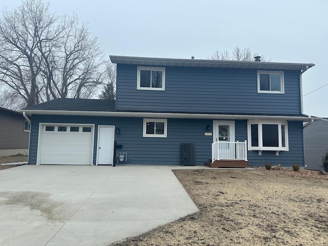 front of property with a garage