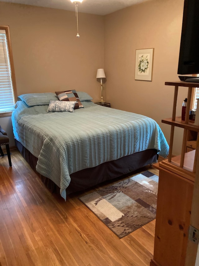 bedroom featuring wood-type flooring