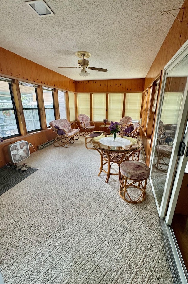 sunroom / solarium with ceiling fan