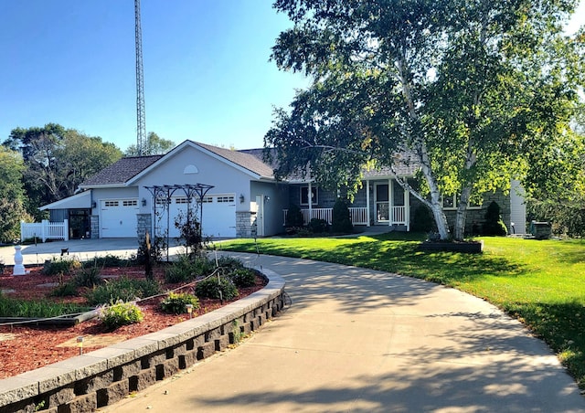 ranch-style home featuring a garage, a porch, and a front lawn