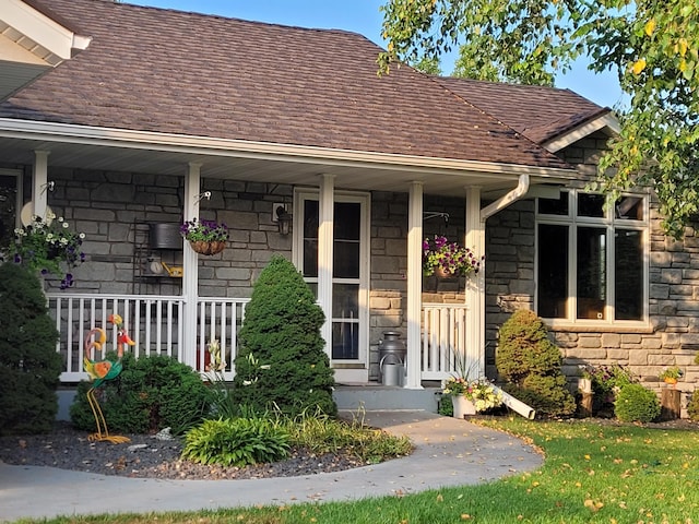 view of exterior entry featuring a porch