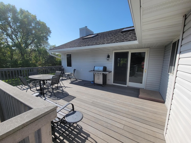 wooden deck with grilling area