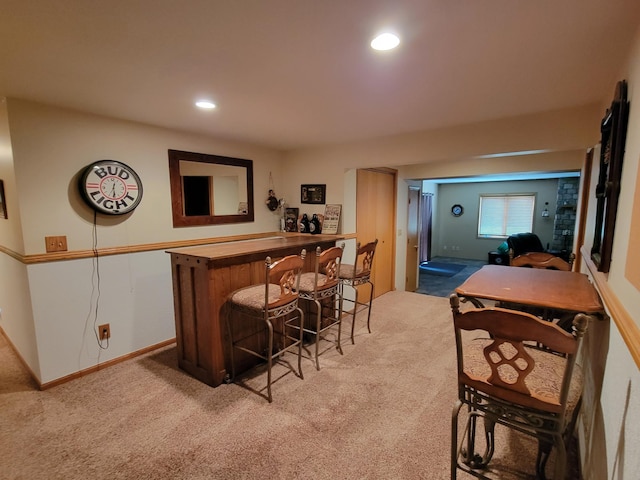 bar featuring light carpet