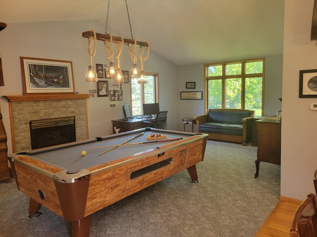 game room with lofted ceiling, hardwood / wood-style flooring, a fireplace, and billiards