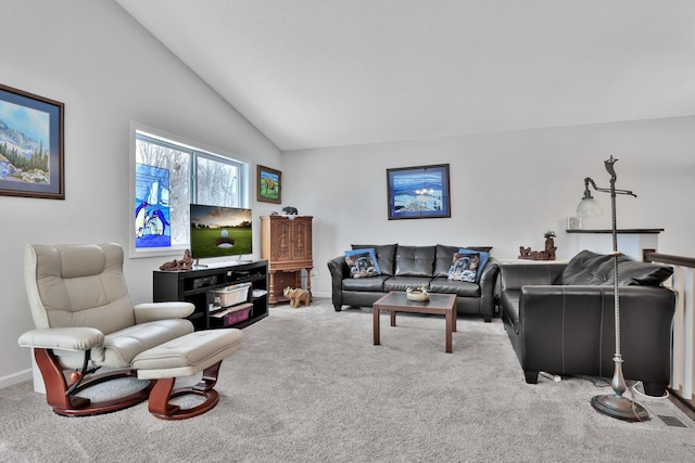 carpeted living room featuring lofted ceiling