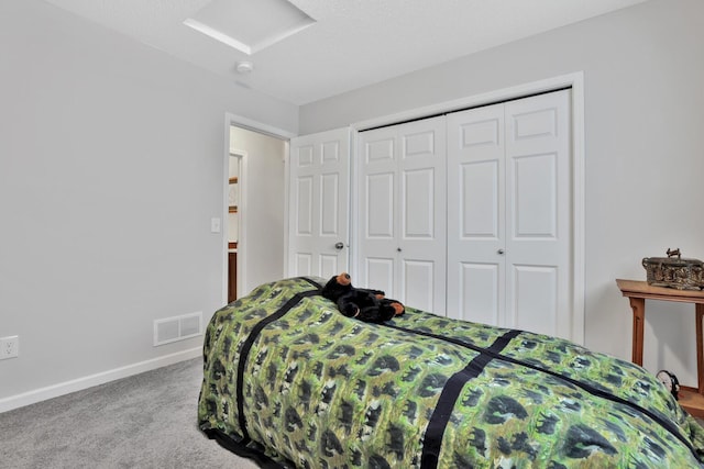 carpeted bedroom with a closet