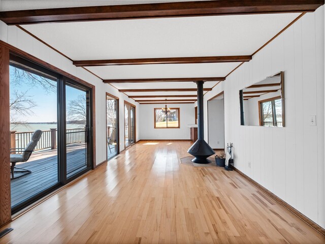 6451 Stardust Ln NE, Carlos Twp, MN 56308 - spare room with a chandelier, light wood-style floors, and beamed ceiling