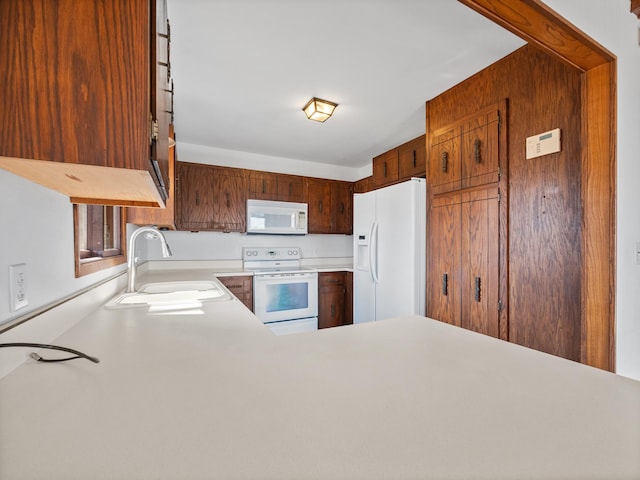 6451 Stardust Ln NE, Carlos Twp, MN 56308 - kitchen featuring white appliances, a sink, and light countertops