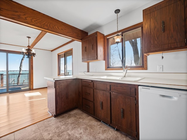 6451 Stardust Ln NE, Carlos Twp, MN 56308 - kitchen featuring dishwasher, a sink, a chandelier, light countertops, and a peninsula