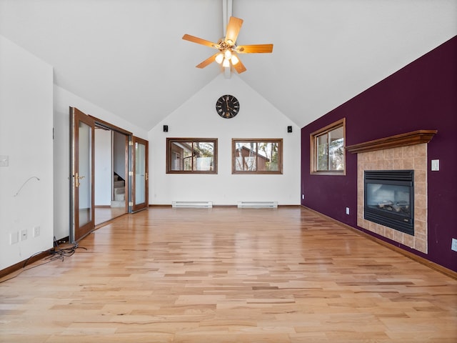 6451 Stardust Ln NE, Carlos Twp, MN 56308 - unfurnished living room with a baseboard radiator, a tiled fireplace, light wood-style floors, ceiling fan, and high vaulted ceiling