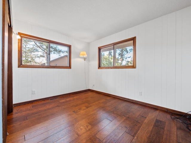6451 Stardust Ln NE, Carlos Twp, MN 56308 - spare room with hardwood / wood-style flooring and baseboards