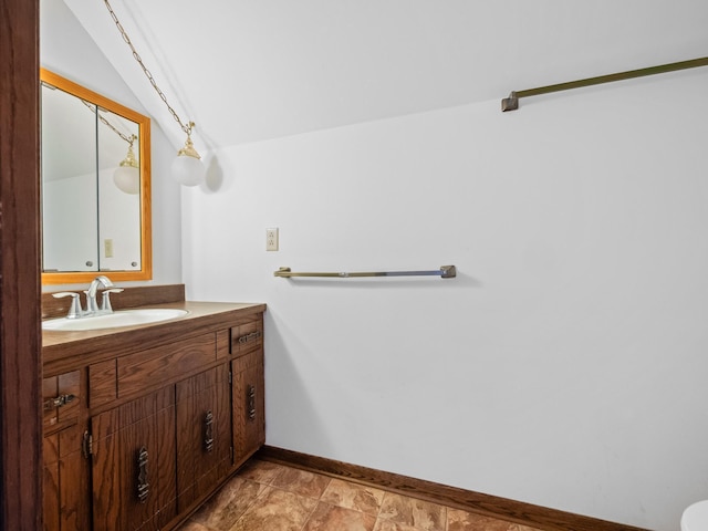 6451 Stardust Ln NE, Carlos Twp, MN 56308 - bathroom featuring baseboards, vanity, and lofted ceiling