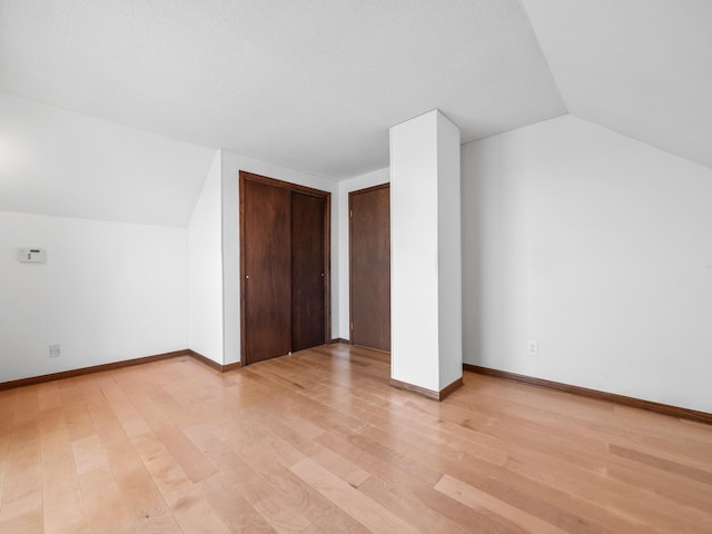 6451 Stardust Ln NE, Carlos Twp, MN 56308 - bonus room with lofted ceiling, light wood-style flooring, and baseboards