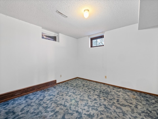 6451 Stardust Ln NE, Carlos Twp, MN 56308 - below grade area with a textured ceiling, carpet floors, and baseboards