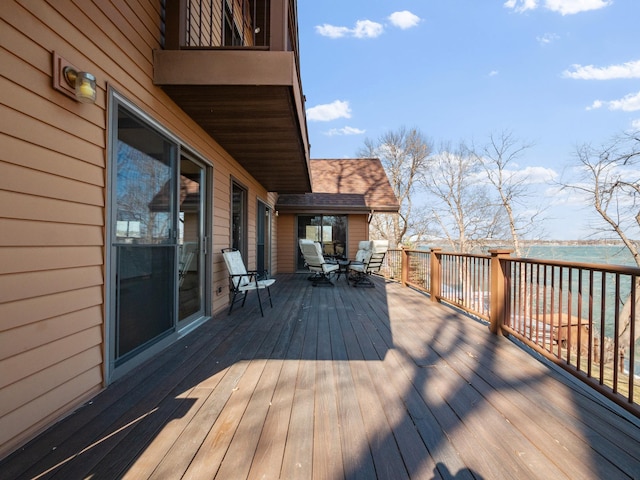 6451 Stardust Ln NE, Carlos Twp, MN 56308 - wooden terrace with outdoor dining space and a water view
