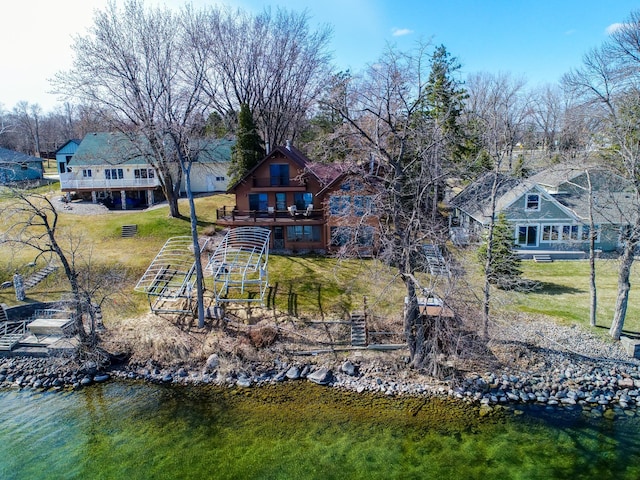 6451 Stardust Ln NE, Carlos Twp, MN 56308 - back of property featuring a deck with water view and a yard