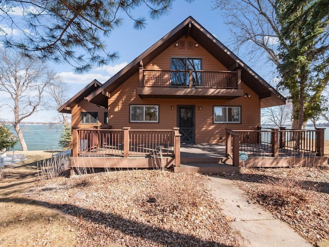 6451 Stardust Ln NE, Carlos Twp, MN 56308 - view of front of home with a balcony and a deck with water view