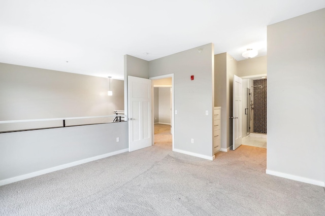 unfurnished bedroom with light colored carpet