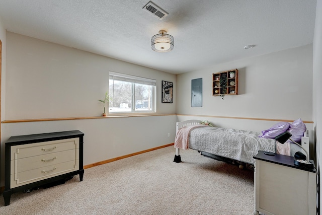 carpeted bedroom featuring electric panel, baseboards, visible vents, and a textured ceiling