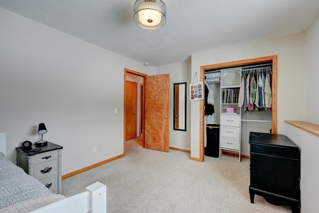 bedroom featuring a closet, baseboards, and carpet