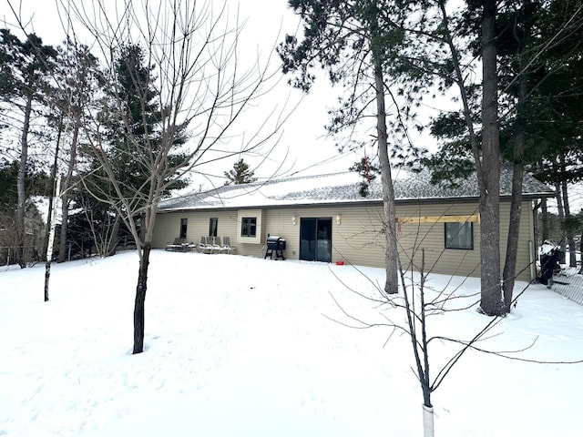 view of snow covered house