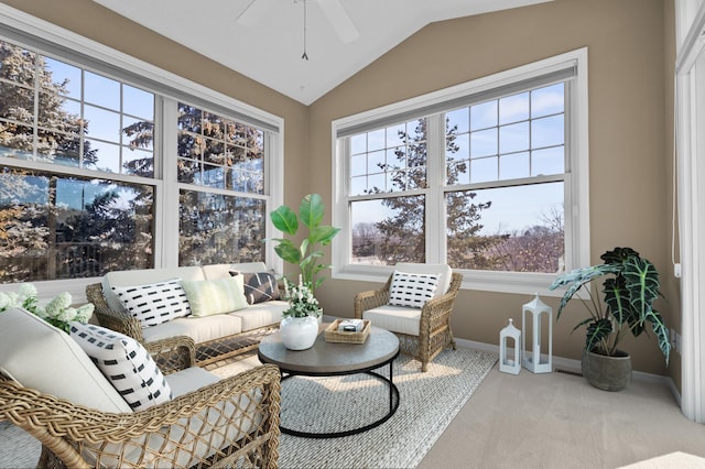 sunroom with lofted ceiling, plenty of natural light, and a ceiling fan