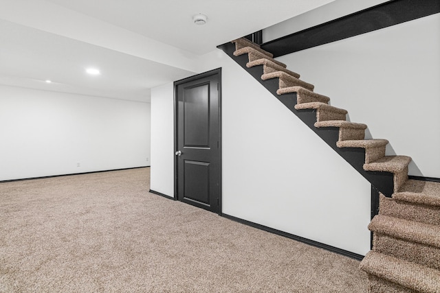 basement with carpet flooring