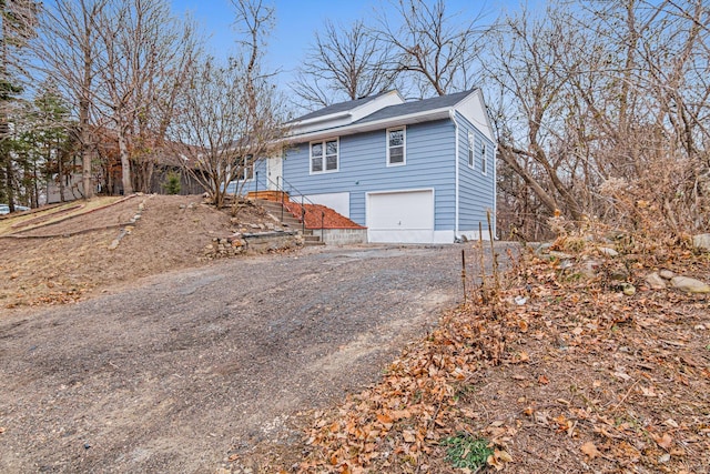 view of side of property featuring a garage