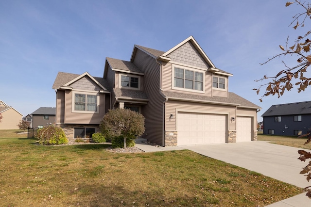 craftsman-style house featuring a garage and a front yard