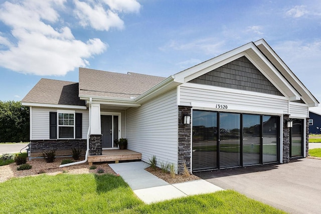 craftsman inspired home with a front yard