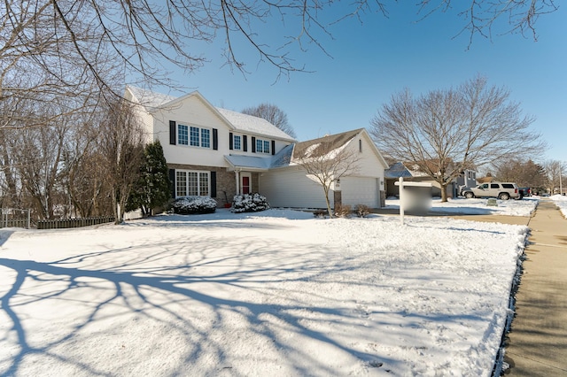 view of front of house with a garage, fence, and brick siding