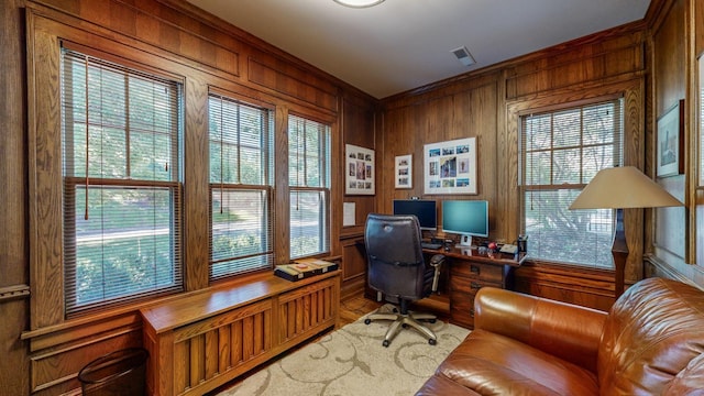 office space featuring wooden walls and ornamental molding