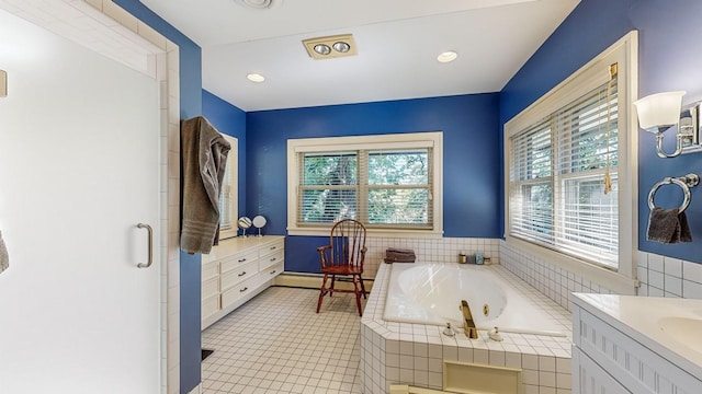 bathroom featuring vanity, a baseboard heating unit, tile patterned flooring, and plus walk in shower