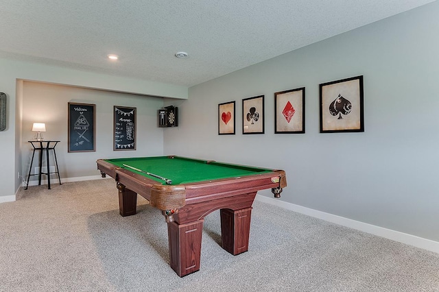 recreation room with light carpet, billiards, and a textured ceiling