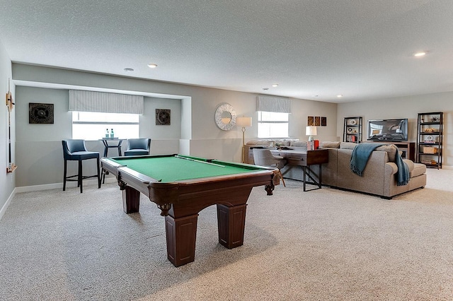 rec room featuring light carpet, billiards, and a textured ceiling