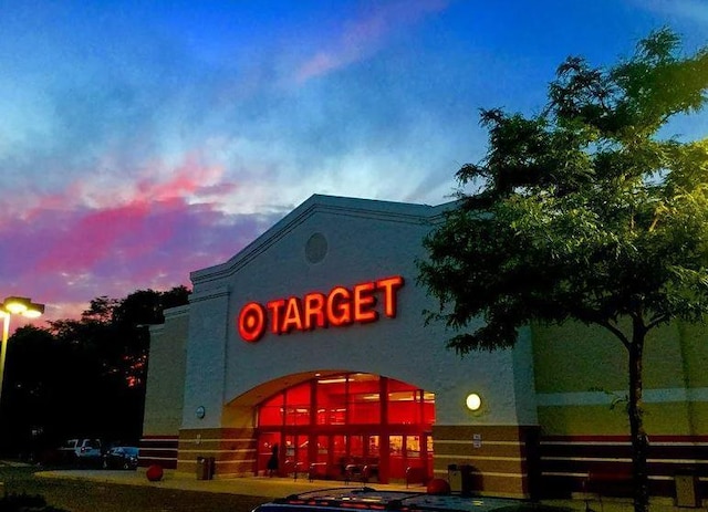 view of outdoor building at dusk