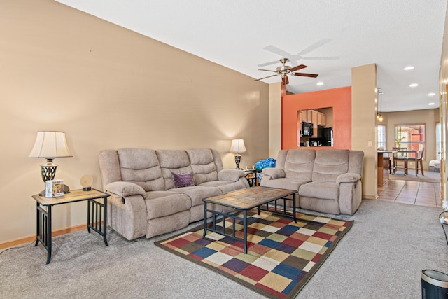 living room with light carpet and ceiling fan