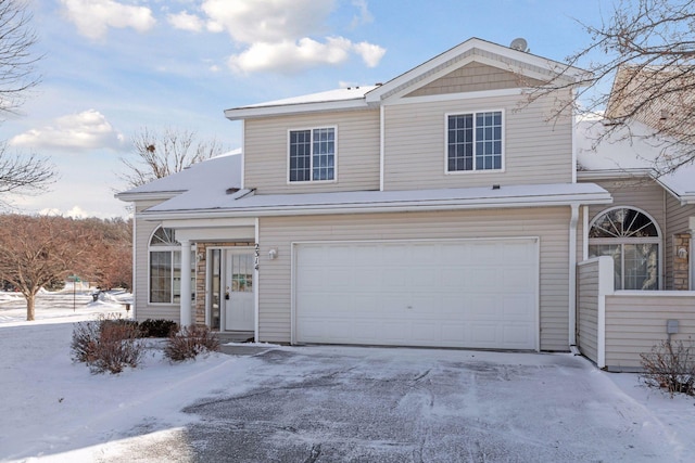 front of property with a garage