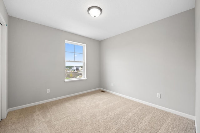 empty room featuring carpet