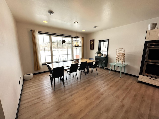 dining area featuring hardwood / wood-style floors