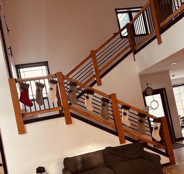 stairs featuring a high ceiling