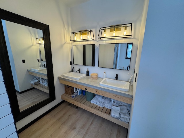 bathroom featuring hardwood / wood-style flooring and vanity