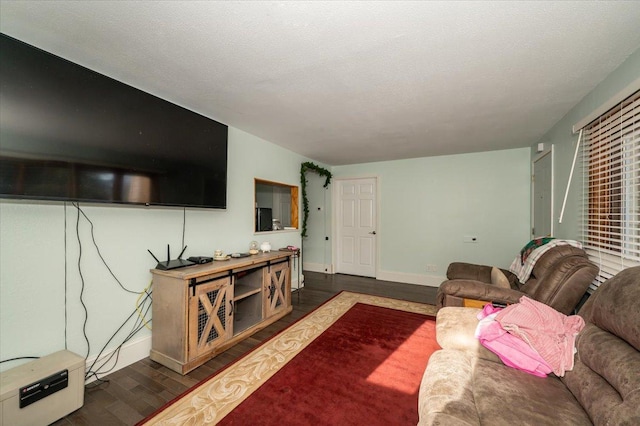 living room with dark wood-style floors and baseboards