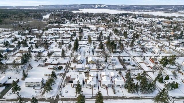snowy aerial view featuring a residential view
